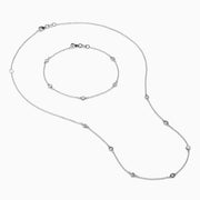 The Pave Classica 14K White Gold Diamond Bezel Station Necklace and Bracelet Set features small, evenly spaced round diamond accents, beautifully displayed on a plain white background.