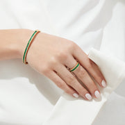 The Brasilica 14K Yellow Gold Emerald and Diamond Ring, 1.27 TCW, showcases a central row of rectangular emeralds bordered by sparkling white diamonds.