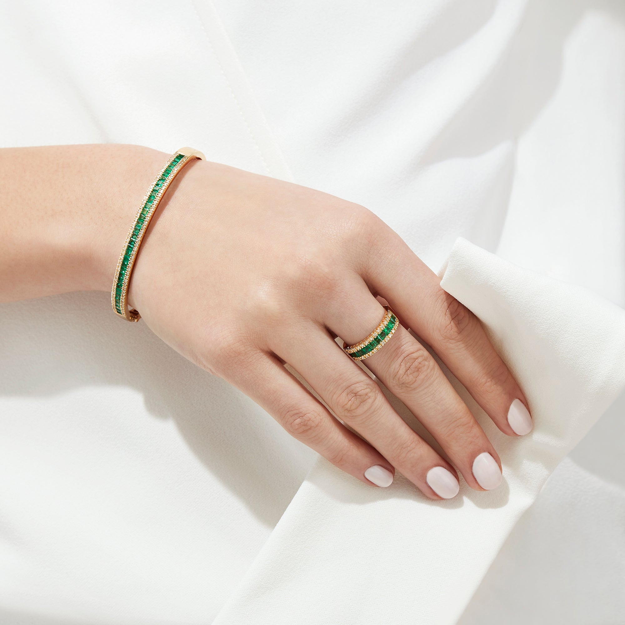 The Brasilica 14K Yellow Gold Emerald and Diamond Ring, 1.27 TCW, showcases a central row of rectangular emeralds bordered by sparkling white diamonds.