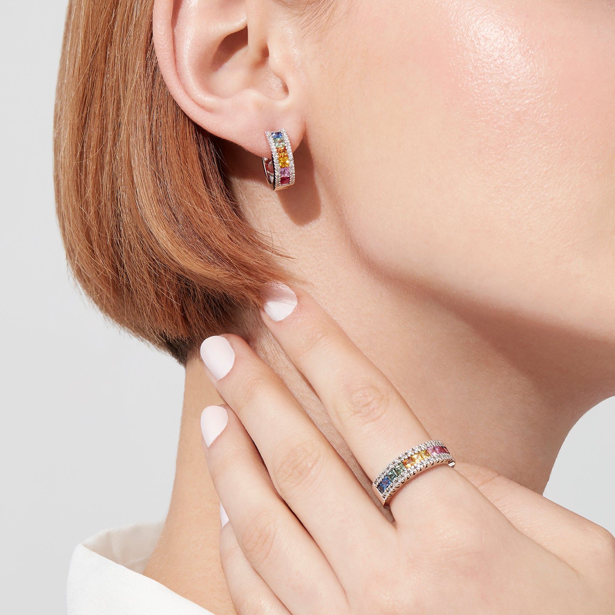 A pair of Watercolors 14K White Gold Sapphire & Diamond Earrings, 1.76 TCW, featuring square-cut sapphires in blue, green, yellow, orange, and pink with diamond borders, shown on a white background.