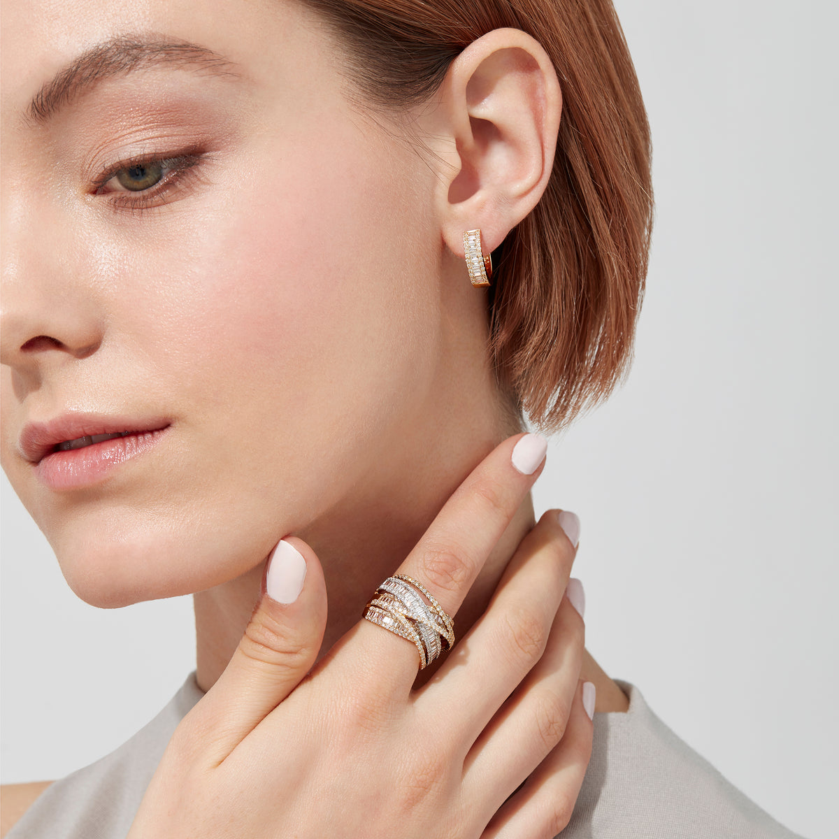 The Duo 14K White and Yellow Gold Diamond Crossover Ring features crisscrossed bands adorned with round and baguette-cut diamonds, showcasing an intricate design with a total carat weight of 2.75.