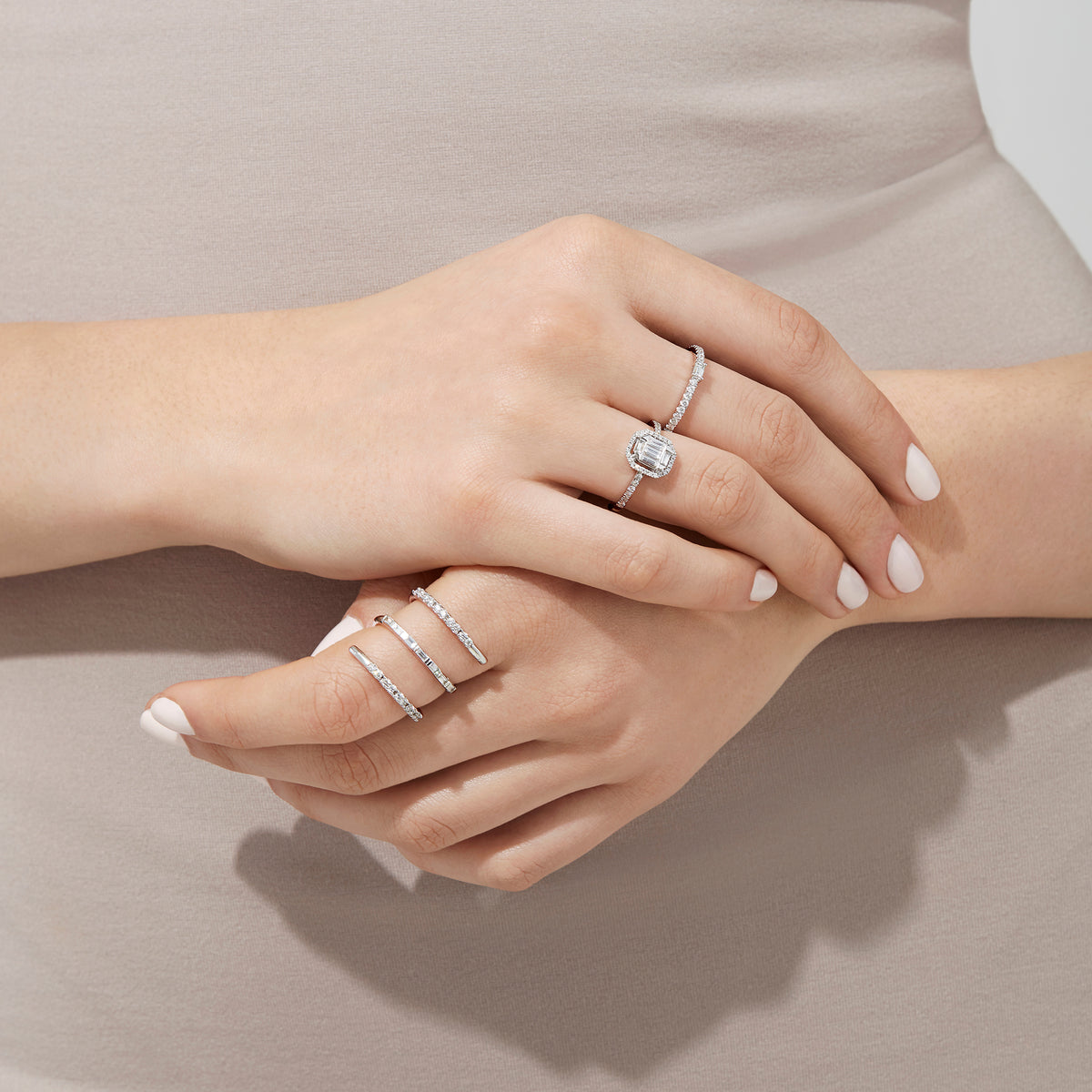 The Classique 14K White Gold Diamond Wrap Ring, 0.52 TCW, features sparkling diamonds along its elegant curves, showcased on a plain white background.