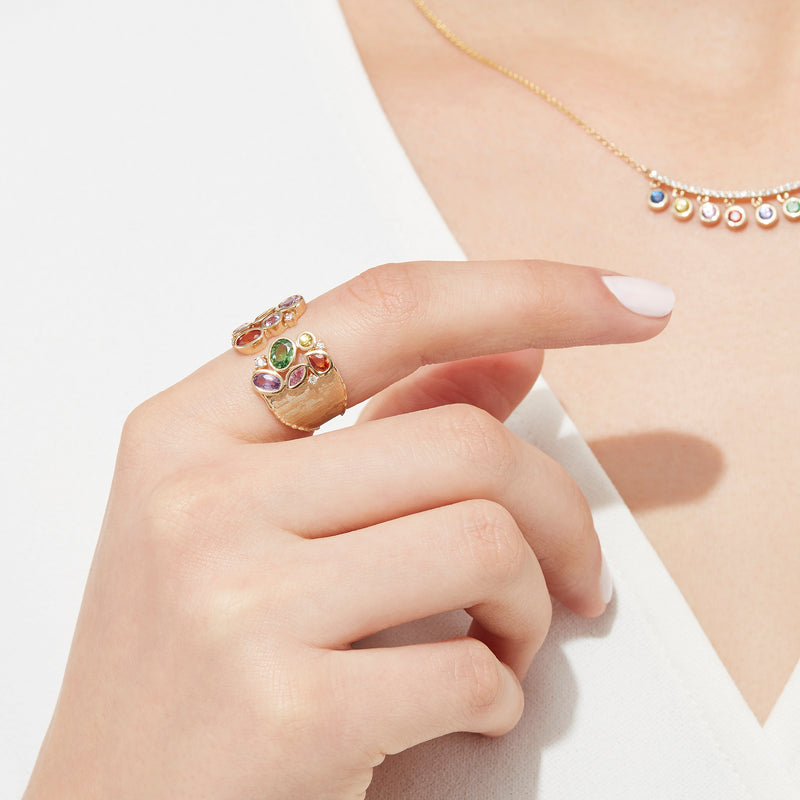 The Watercolors 14K Yellow Gold Multi Sapphire and Diamond Ring (2.46 TCW) features sapphires in green, purple, yellow, orange, and pink hues of various shapes and sizes, accented by sparkling diamonds.