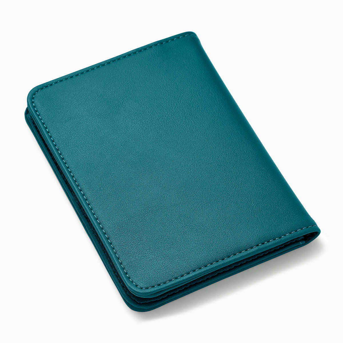 Teal Vegan Leather Passport Holder open to display card slots on the left, a transparent ID section in the center, and a larger pocket on the right, all crafted from vegan leather against a white background.