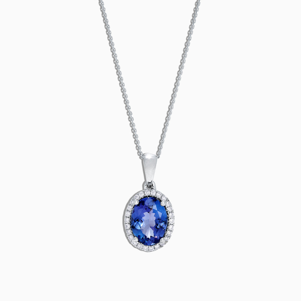 A 14K white gold pendant with an oval tanzanite (1.86 TCW) surrounded by diamonds, shown on a plain white background.