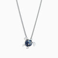 The 925 Sterling Silver Sapphire Splash Turtle Pendant (1.00 TCW) features blue and white gemstones on its shell and is shown against a white background.