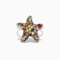 The 925 Sterling Silver Multi Sapphire Splash Starfish Ring, 2.90 TCW, features a starfish design set with vibrant blue, yellow, orange, pink, and clear sapphires—an Effy piece that dazzles against a white backdrop.