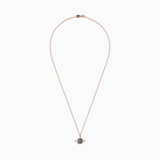 A 14K rose gold chain necklace with a blue, white, and black diamond evil eye pendant (0.34 TCW).