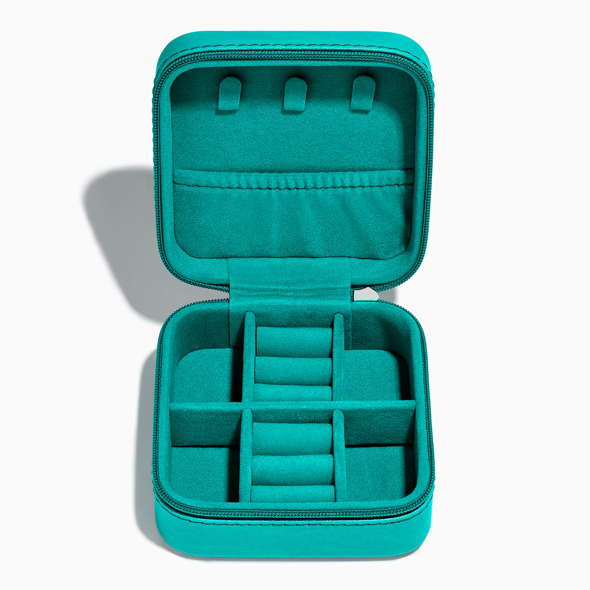 The Faux Leather Jewelry Travel Case is a square teal case with a textured leopard print accent on one corner and EFFY embossed on the lid. It features a zipper closure and is shown on a light background with a soft shadow.