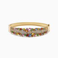 The Watercolors 14K Yellow Gold Multi Sapphire & Diamond Bangle, 9.97 TCW, features vibrant sapphires and sparkling diamonds set in an intricate clustered design.