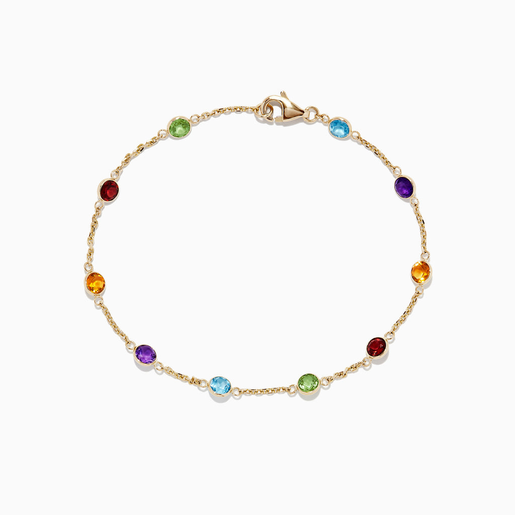 The Mosaic 14K Yellow Gold Multi Gemstone Station Bracelet, 2.47 TCW, features round red, green, blue, purple, and amber gemstones spaced along a delicate chain with a secure lobster clasp.