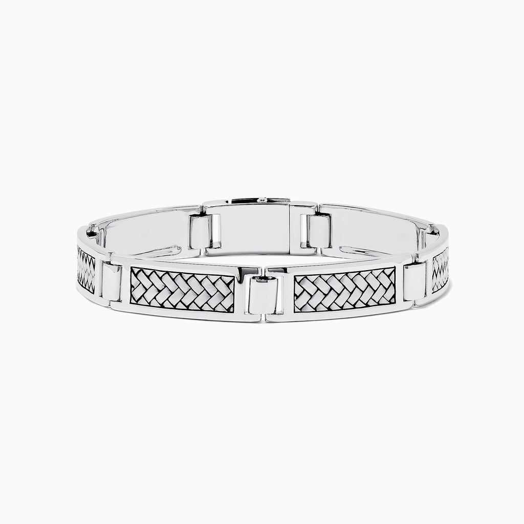 A stylish Mens 925 Sterling Silver Bracelet showcases polished silver segments with bold black woven pattern inlays, elegantly displayed on a plain white background.