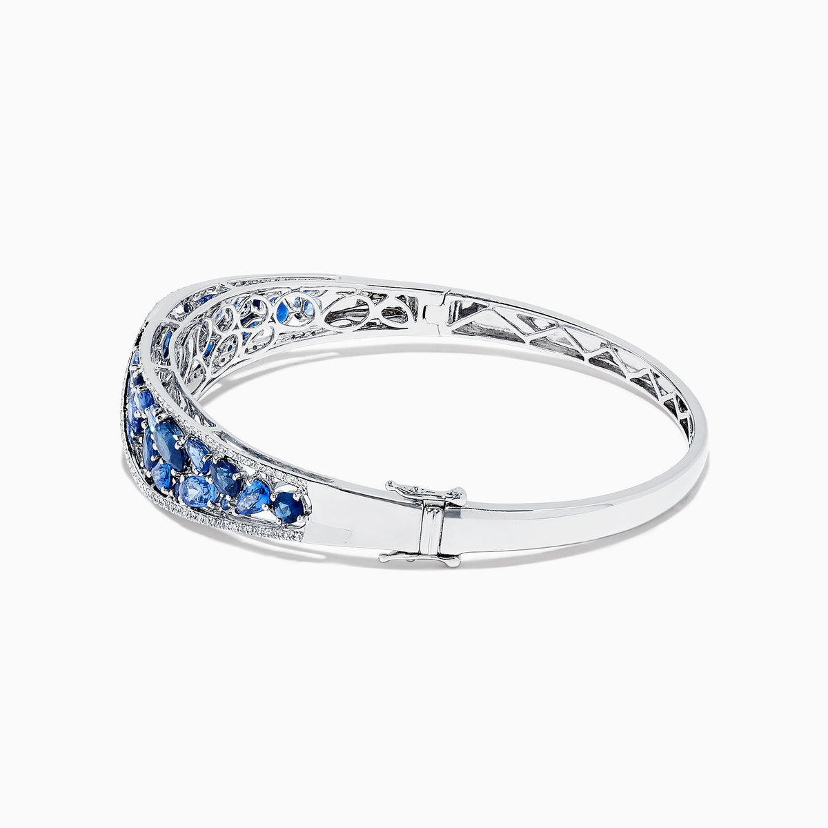 The 14K White Gold Natural Blue Sapphire & Diamond Bangle (7.82 TCW) features an intricate lattice design with clusters of round blue sapphires and sparkling diamonds along the front.