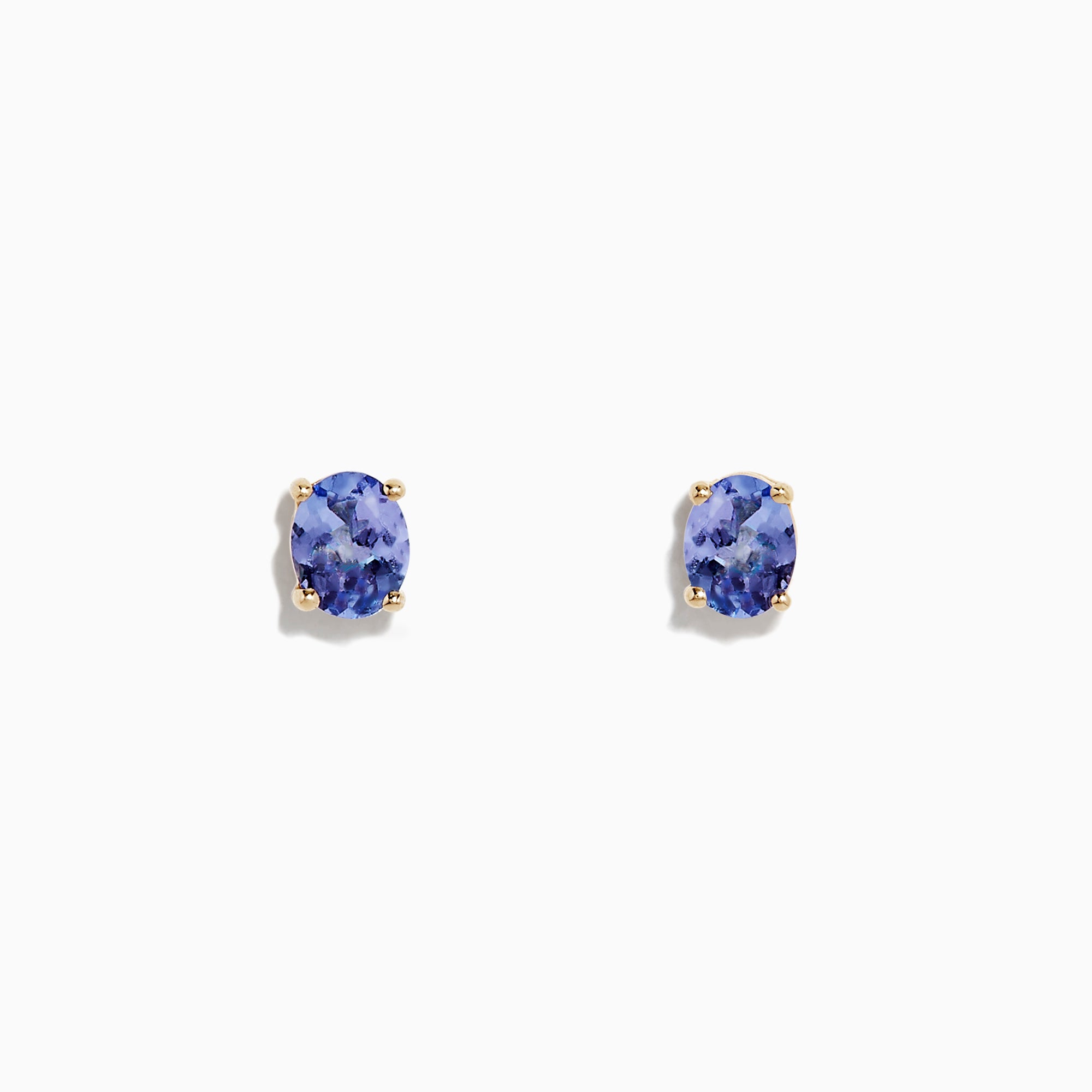 A pair of 14K Yellow Gold Oval Tanzanite Stud Earrings, 0.65 TCW, is shown on a white background.