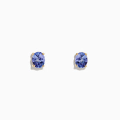 A pair of 14K Yellow Gold Oval Tanzanite Stud Earrings, 0.65 TCW, is shown on a white background.