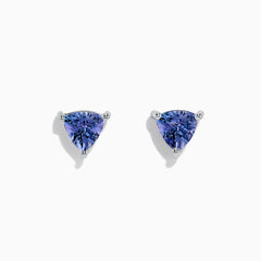 The 14K White Gold Trillion Cut Tanzanite Stud Earrings, 0.65 TCW, feature trillion-cut tanzanite gemstones in three-prong settings displayed against a white background.