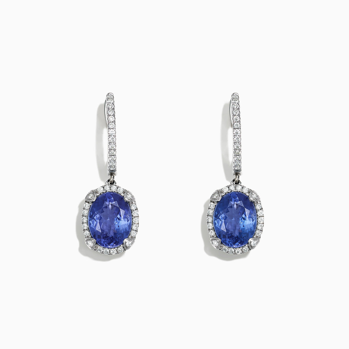 Elegant 14K white gold earrings featuring oval tanzanite gemstones and sparkling diamonds, totaling 4.14 TCW, with additional diamonds along the hooks.