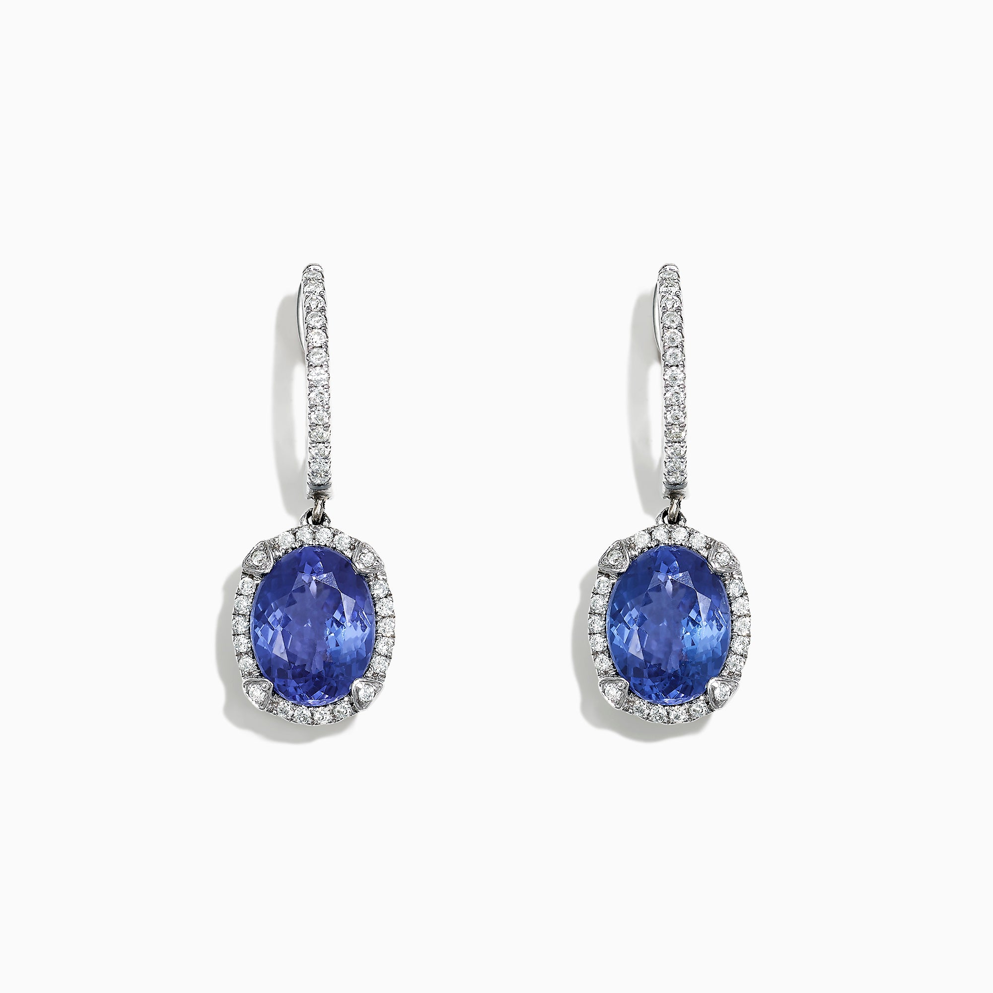 Elegant 14K white gold earrings featuring oval tanzanite gemstones and sparkling diamonds, totaling 4.14 TCW, with additional diamonds along the hooks.