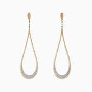 Duo 14K Yellow and White Gold Diamond Statement Earrings, 1.63 TCW, feature elegant teardrop shapes with sparkling diamonds accenting the gold and silver tones along the edges and inner curves.