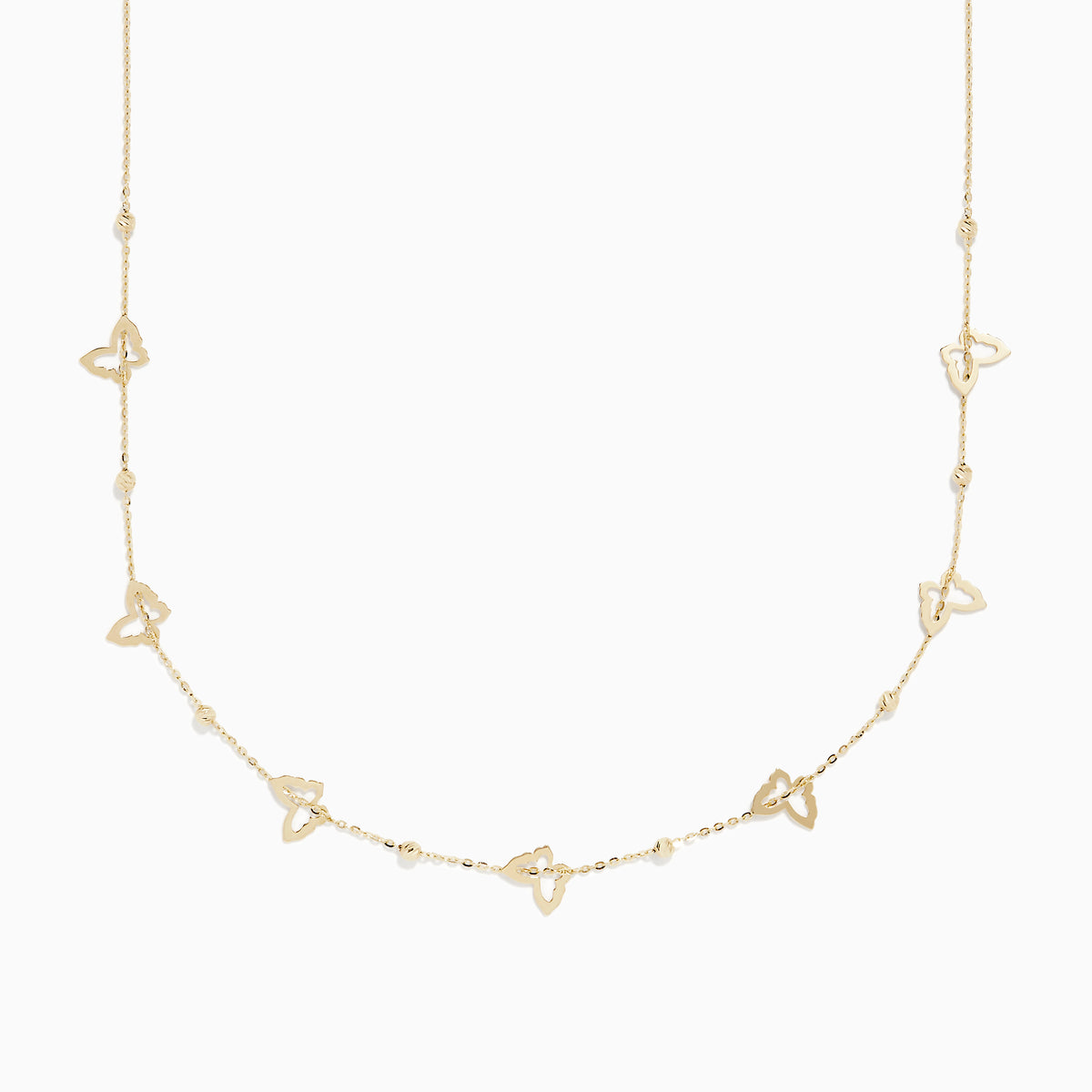 The 14K Yellow Gold Mini Butterflies Necklace features small, open butterfly charms spaced along a fine gold chain for a simple yet elegant design.