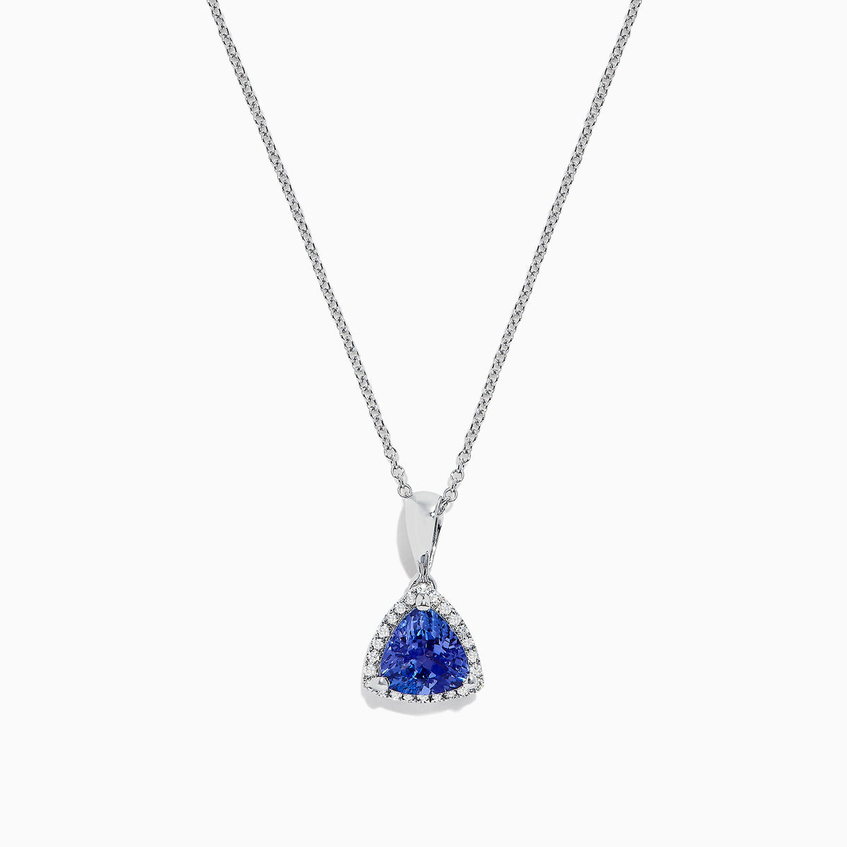 The Nahla Siri 14K White Gold Tanzanite and Diamond Trillion Pendant (0.72 TCW) features a triangular blue tanzanite framed by diamonds, displayed on a fine chain against a white background.