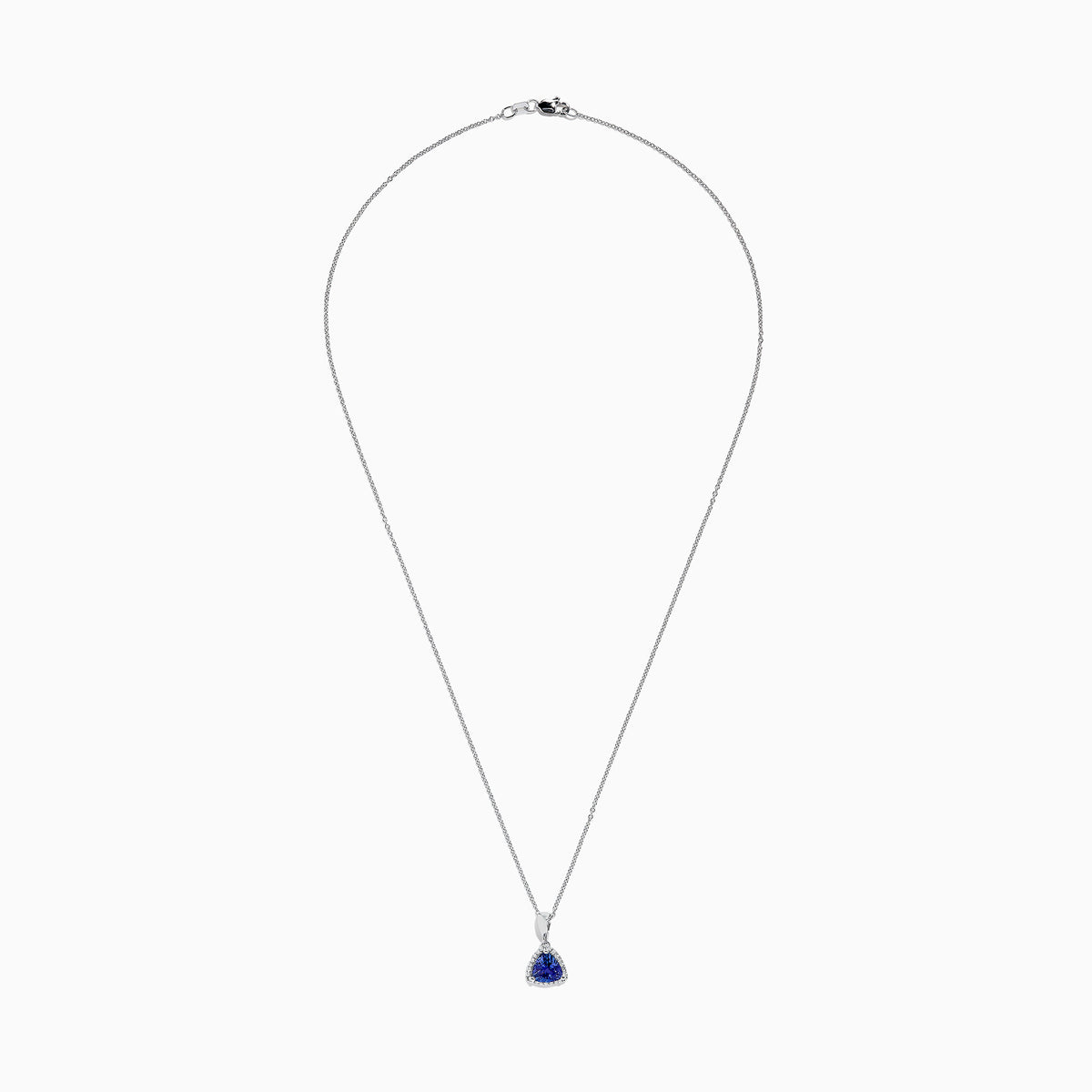 The Nahla Siri 14K White Gold Tanzanite and Diamond Trillion Pendant (0.72 TCW) features a triangular blue tanzanite framed by diamonds, displayed on a fine chain against a white background.