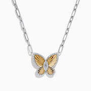The 14K Two-Tone Gold Diamond Butterfly Necklace features a gold and silver butterfly pendant with diamond accents and a central gemstone, displayed on a plain white background.