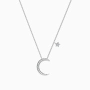 A Novelty 14K White Gold Diamond Crescent & Star Necklace (0.09 TCW) features a crescent moon pendant with sparkling diamonds and a separate star charm on a fine chain, shown against a white background.