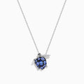 The Seaside 925 Sterling Silver Multi Diamond and Tanzanite Turtle Pendant features a turtle-shaped design with tanzanite gemstones on its shell and clear stones on one flipper, shown against a white background.