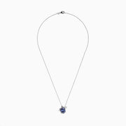 The Seaside 925 Sterling Silver Multi Diamond and Tanzanite Turtle Pendant features a turtle-shaped design with tanzanite gemstones on its shell and clear stones on one flipper, shown against a white background.