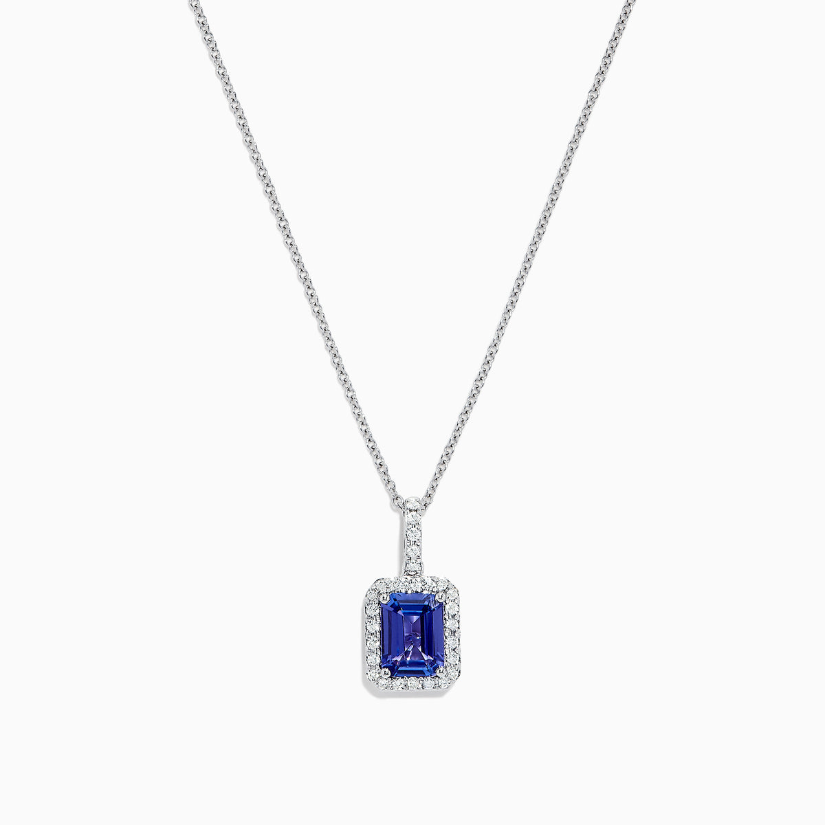 The Nahla Siri 14K White Gold Tanzanite and Diamond Pendant, 1.56 TCW, features a rectangular tanzanite surrounded by sparkling diamonds, elegantly displayed against a white background.