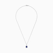 The Nahla Siri 14K White Gold Tanzanite and Diamond Pendant, 1.56 TCW, features a rectangular tanzanite surrounded by sparkling diamonds, elegantly displayed against a white background.