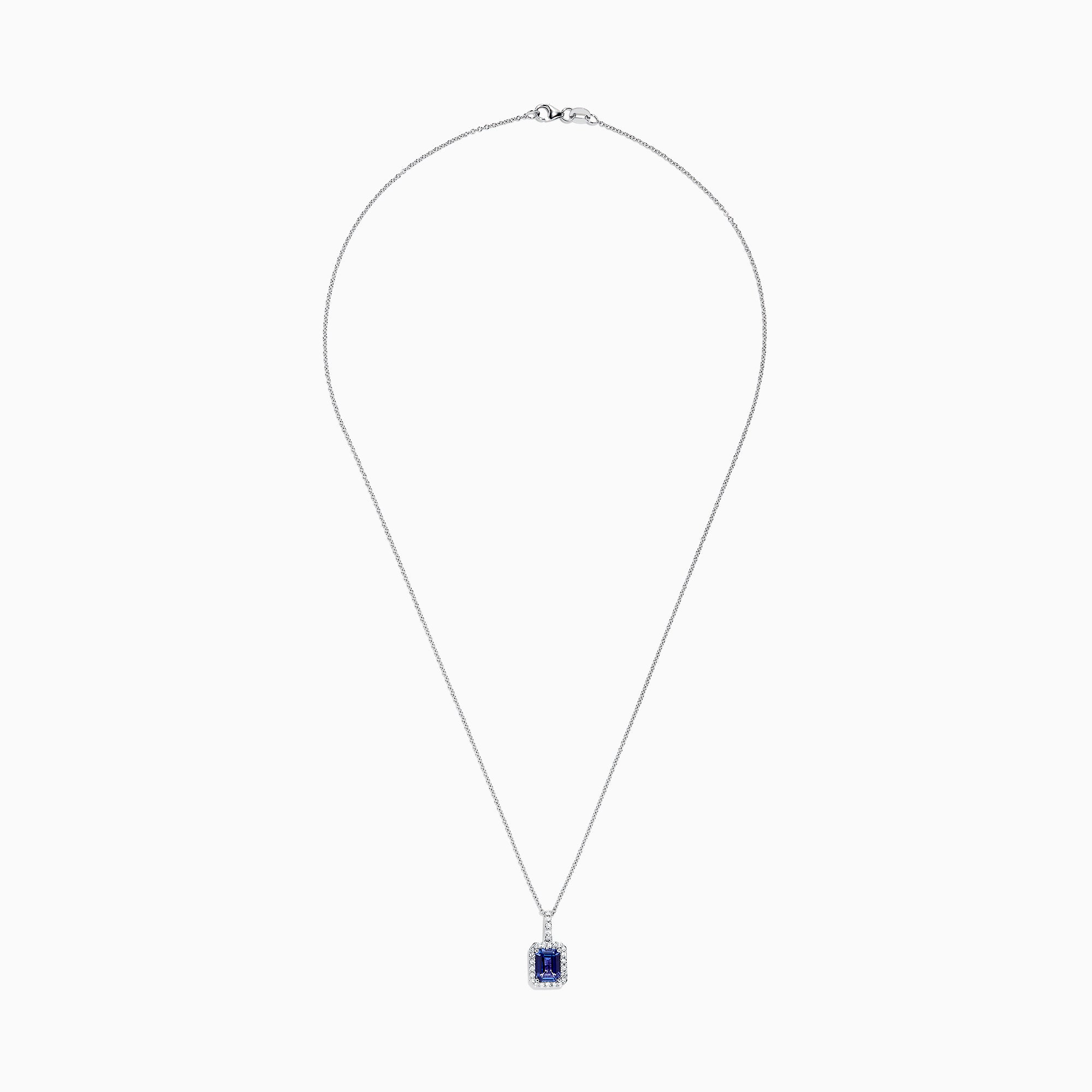 The Nahla Siri 14K White Gold Tanzanite and Diamond Pendant, 1.56 TCW, features a rectangular tanzanite surrounded by sparkling diamonds, elegantly displayed against a white background.