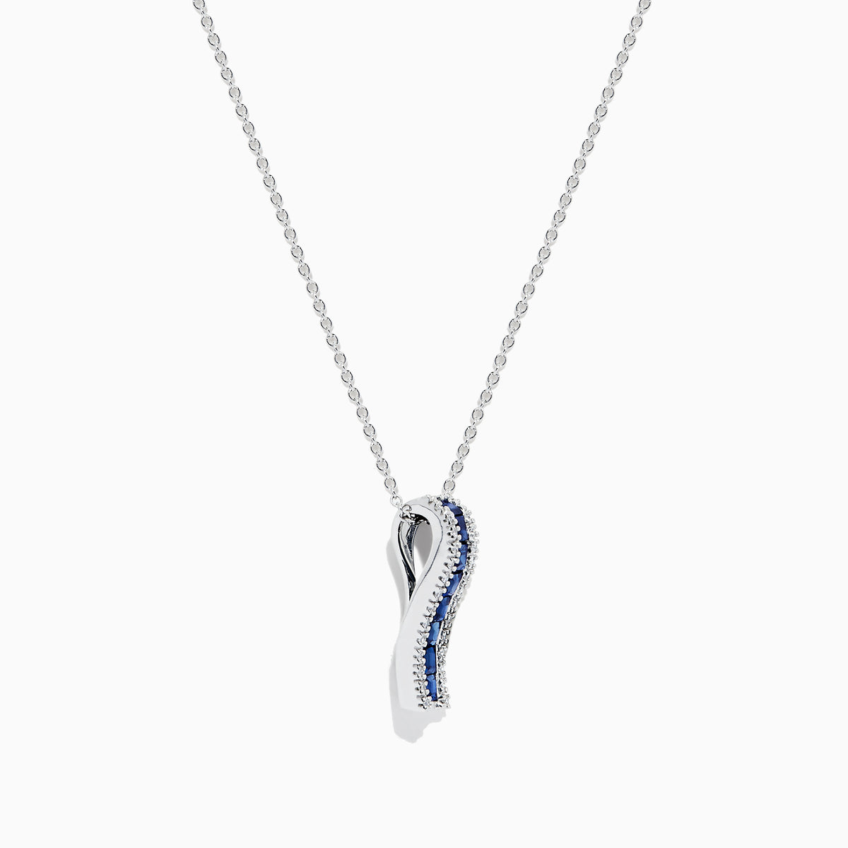 The 14K White Gold Blue Sapphire and Diamond Pendant (1.20 TCW) features a vertical design with square-cut blue sapphires at the center, bordered by sparkling diamonds.