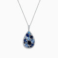 The 14K White Gold Sapphire and Diamond Drop Pendant, 3.80 TCW, features a teardrop design with clusters of dark and light sapphires, accented by diamonds on a silver chain, shown on a white background and inspired by Effy’s signature elegance.