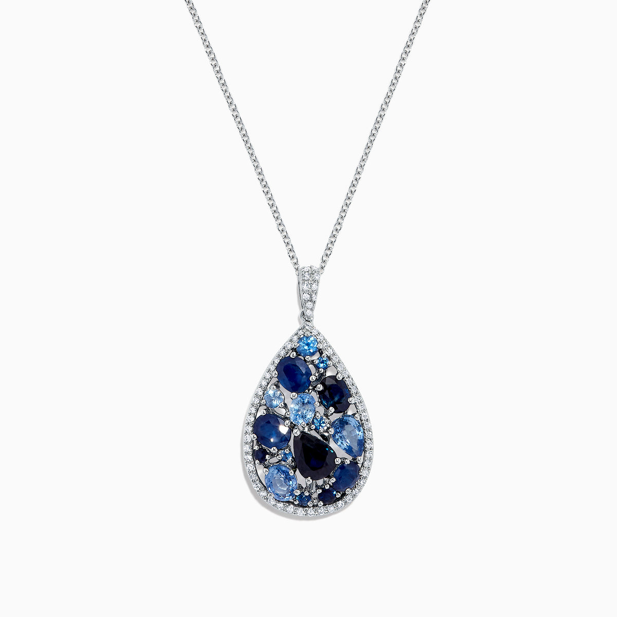 The 14K White Gold Sapphire and Diamond Drop Pendant, 3.80 TCW, features a teardrop design with clusters of dark and light sapphires, accented by diamonds on a silver chain, shown on a white background and inspired by Effy’s signature elegance.