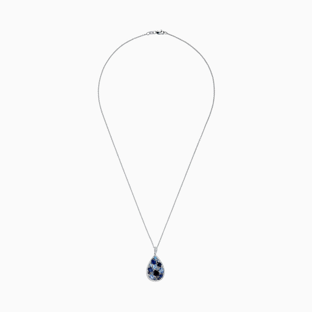 The 14K White Gold Sapphire and Diamond Drop Pendant, 3.80 TCW, features a teardrop design with clusters of dark and light sapphires, accented by diamonds on a silver chain, shown on a white background and inspired by Effy’s signature elegance.