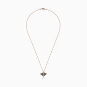 The Seaside 14K Gold Espresso & White Diamond Stingray Pendant (0.46 TCW) features a delicate rose gold design adorned with dark and white diamonds, showcased on a plain white background.