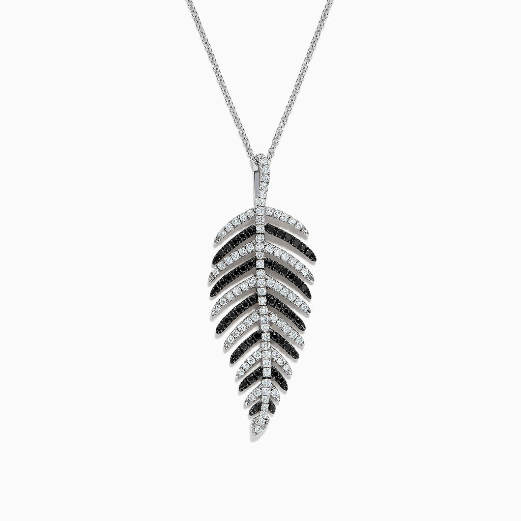A 14K white gold pendant with .89 TCW black and white diamonds, arranged along leaf-shaped veins, hangs from a thin chain—reminiscent of Effy’s style—shown against a white background.