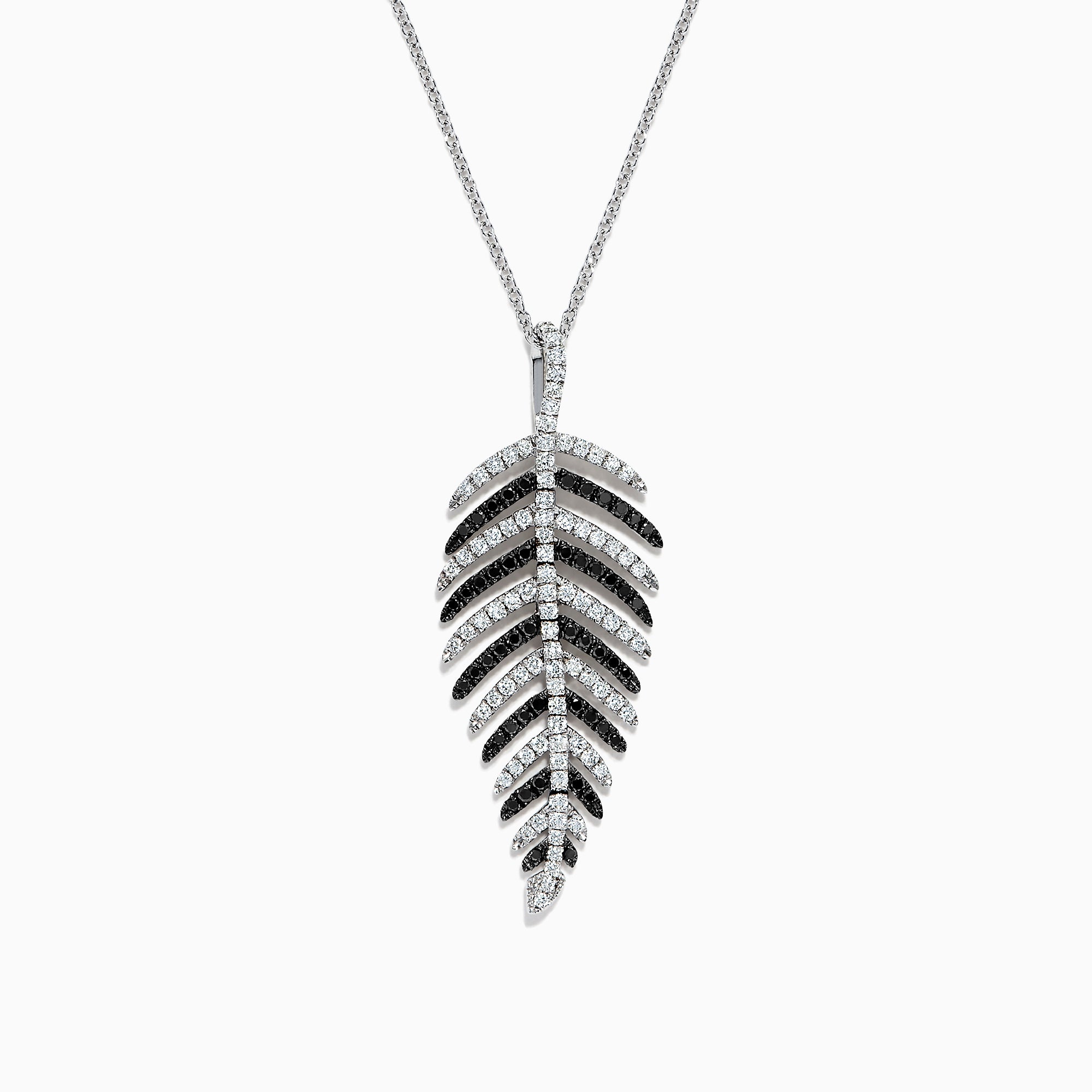 A 14K white gold pendant with .89 TCW black and white diamonds, arranged along leaf-shaped veins, hangs from a thin chain—reminiscent of Effy’s style—shown against a white background.