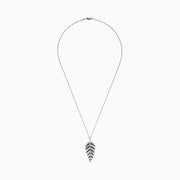 A 14K white gold pendant with .89 TCW black and white diamonds, arranged along leaf-shaped veins, hangs from a thin chain—reminiscent of Effy’s style—shown against a white background.