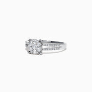 The Bouquet 14K White Gold Diamond Cluster Ring, 0.56 TCW, showcases a brilliant diamond cluster and a split shank band adorned with sparkling diamonds, beautifully presented on a white background.