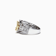 The Canare 14K Two-Tone Gold Yellow and White Diamond Ring, 2.16 TCW, showcases a striking yellow diamond cluster encircled by white diamonds on a split shank band, elegantly set against a white background.
