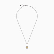 The Canare 18K Two-Tone Gold Yellow and White Diamond Pendant (0.74 TCW) is a silver necklace featuring a teardrop design with yellow gemstones and white diamonds, both surrounded by halos of sparkling stones for added elegance.