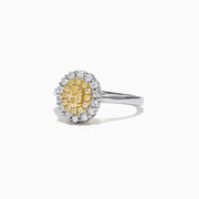 The Canare 18K Two-Tone Gold Oval Double Halo Yellow Diamond Ring, 0.65 TCW, features a central oval yellow diamond cluster and twin white diamond halos, elegantly set against a plain white background.