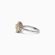 The Canare 18K Two-Tone Gold Oval Double Halo Yellow Diamond Ring, 0.65 TCW, features a central oval yellow diamond cluster and twin white diamond halos, elegantly set against a plain white background.