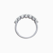 The Pave Classica 14K White Gold Diamond Band 1.03 TCW showcases seven round diamonds in a sleek, minimalist white gold band, elegantly presented against a plain white background.