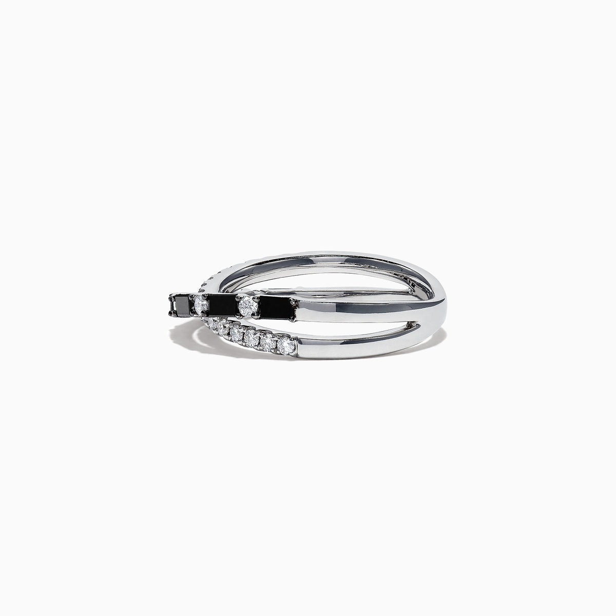 The 14K White Gold Black and White Diamond Crossover Ring, 0.77 TCW, features two intertwined bands with alternating black and white diamonds, displayed on a white background.