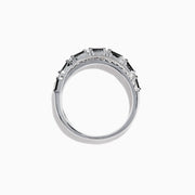 The 14K White Gold Black and White Diamond Crossover Ring, 0.77 TCW, features two intertwined bands with alternating black and white diamonds, displayed on a white background.
