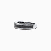 The 14K White Gold Black and White Diamond Band Ring, 1.06 TCW, showcases a row of rectangular black diamonds framed by two rows of round white diamonds on a sleek white gold band.